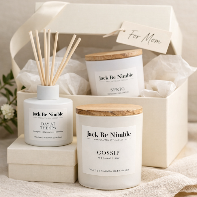 Gift set with candles and diffuser labeled 'Jack Be Nimble' on a neutral background
