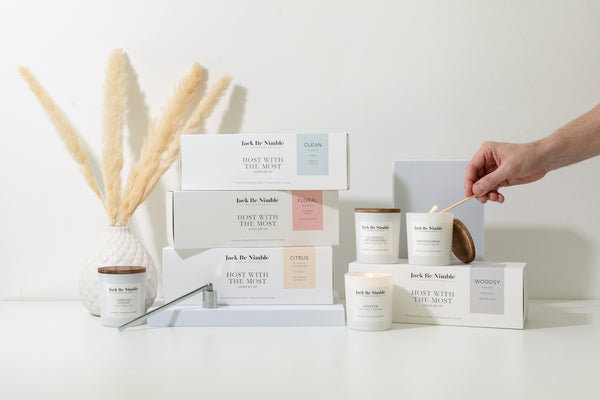 Jack Be Nimble Host With the Most candle gift sets in Clean, Floral, Citrus, and Woodsy scents, with soy candles like Thread Count, Moonflower, and Hipster. Hand-poured candles with wood lids in minimalist packaging.
