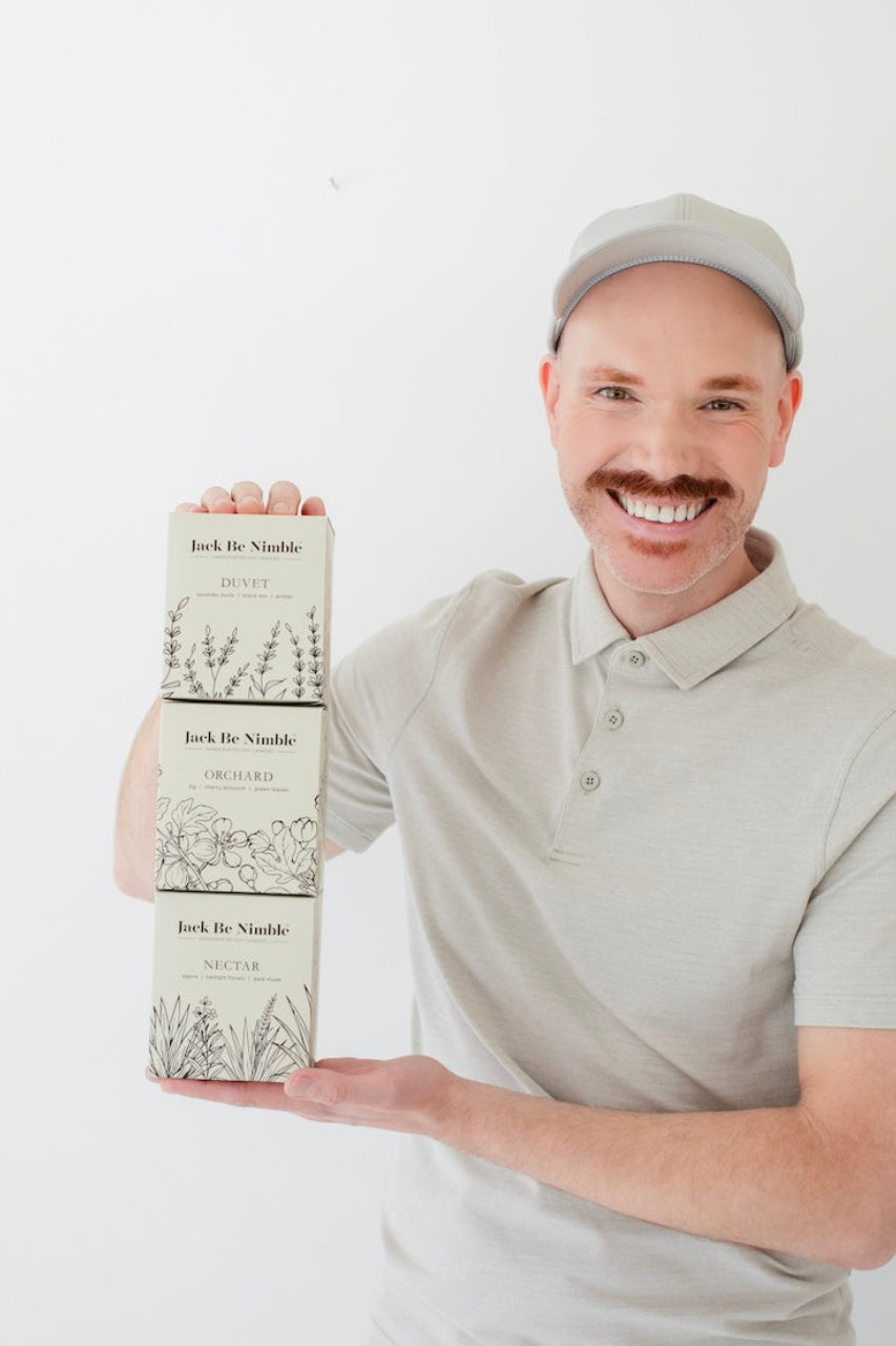 Paul the founder holding three boxes labeled 'Jack Be Nimble' against a white background